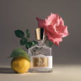 Load image into Gallery viewer, Aventus For Her by Creed, bottle with raw materials

