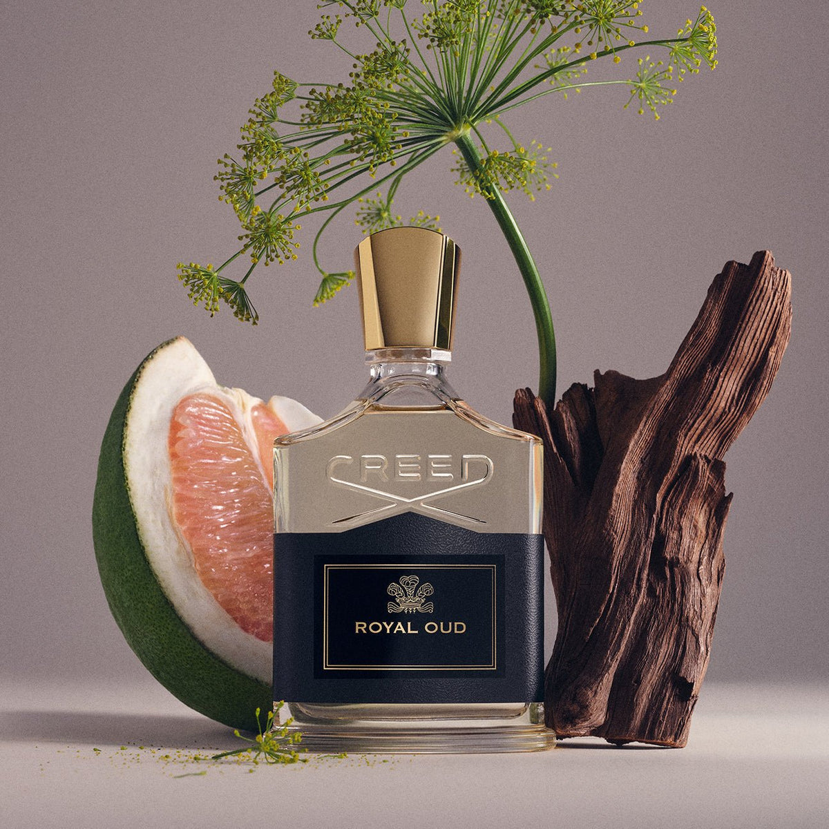 Royal Oud by Creed, bottle with raw materials