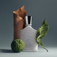 Load image into Gallery viewer, Silver Mountain Water by Creed, bottle with raw materials
