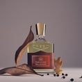 Load image into Gallery viewer, Tabarome Millésime by Creed, bottle with raw materials
